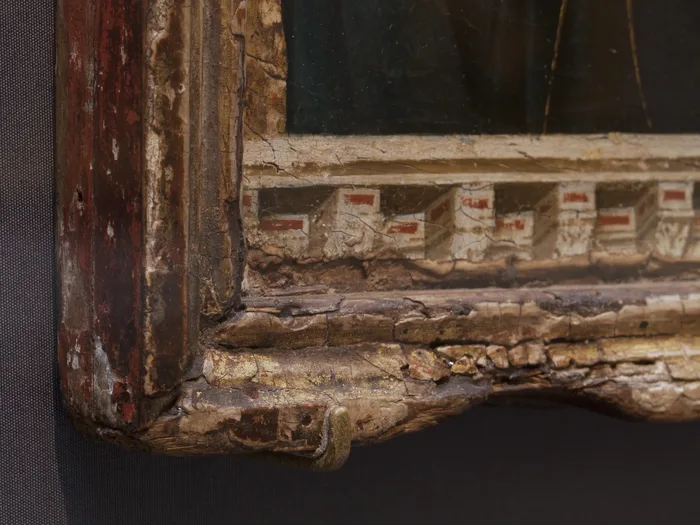 Duccio's Madonna and Child: candle burns along the frame