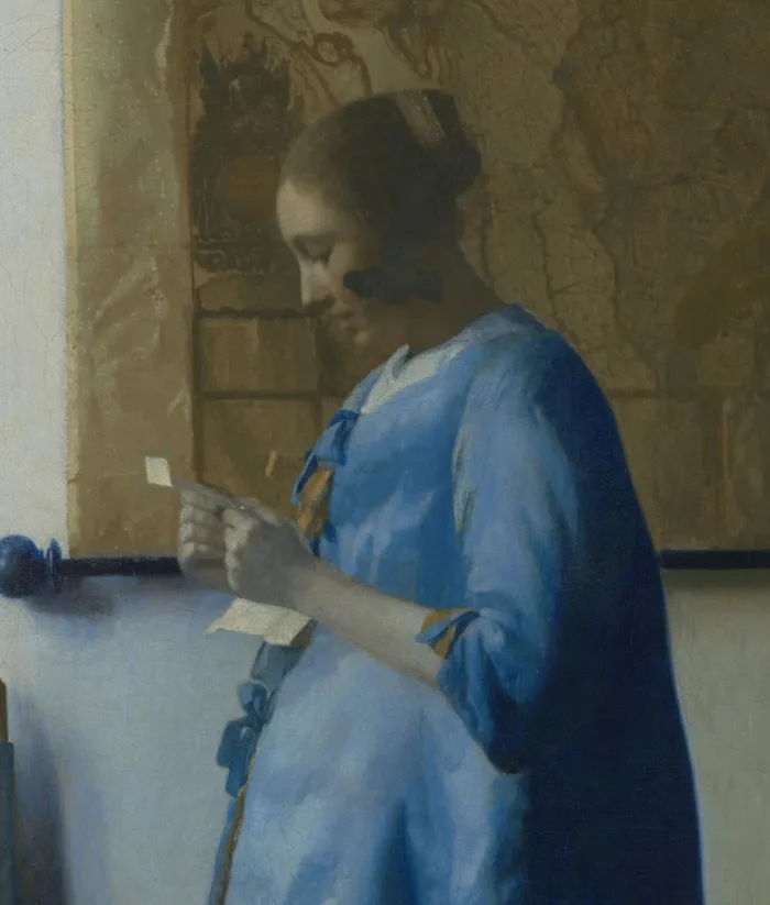 Woman in Blue Reading a Letter