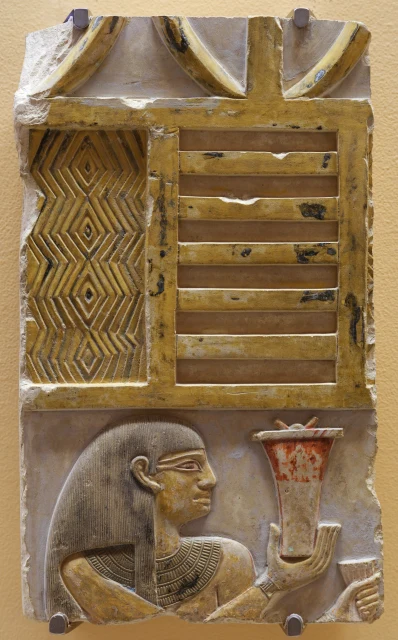 Wall Relief of a Woman Bringing an Offering Vase