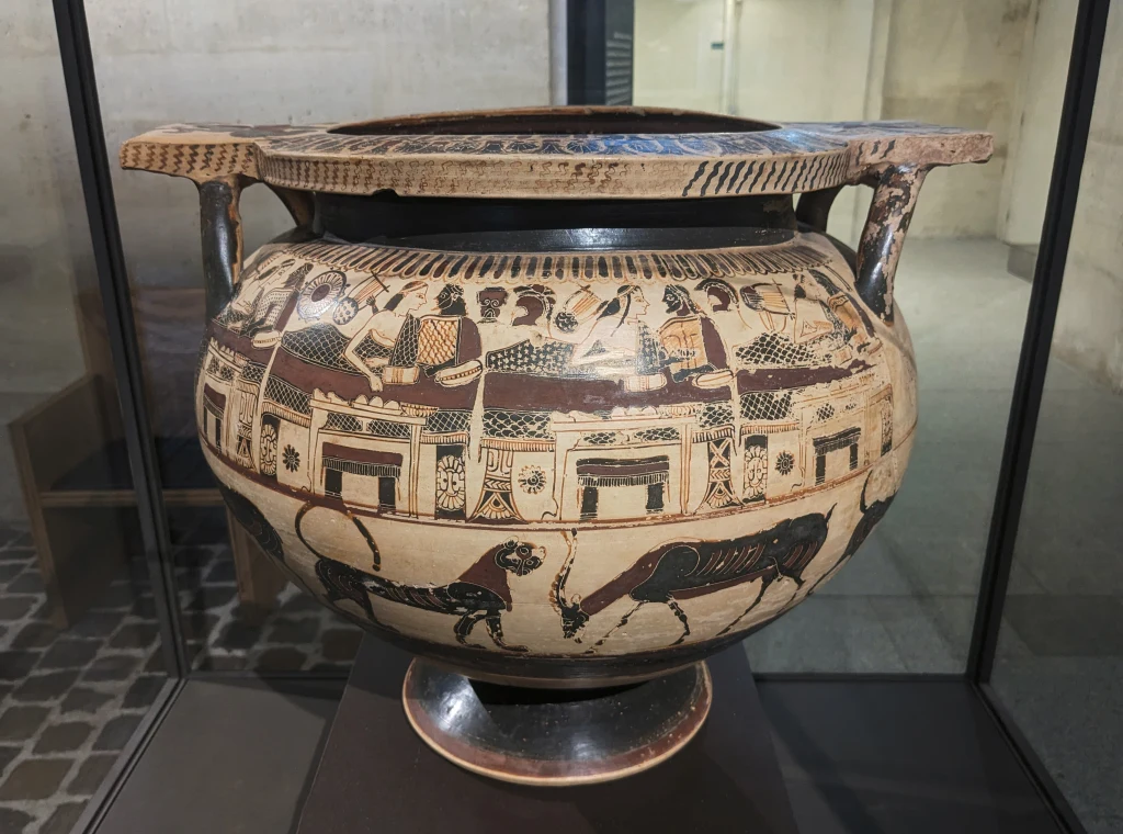 Cratère à colonnettes corinthien avec banquet et cavaliers