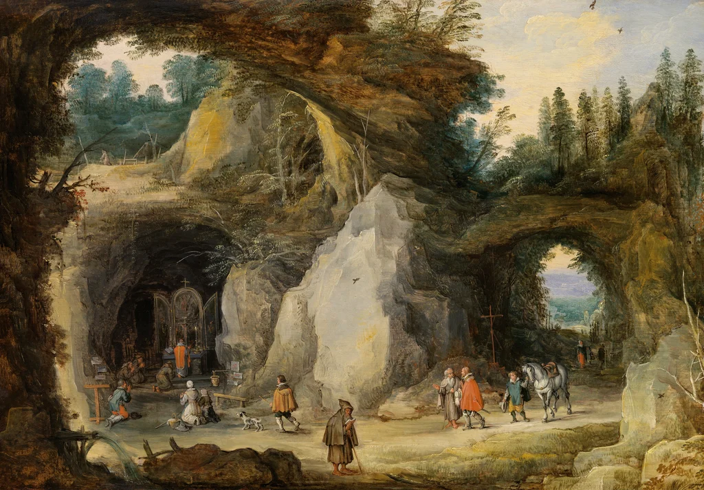 Paysage montagneux avec des pèlerins à une chapelle dans une grotte