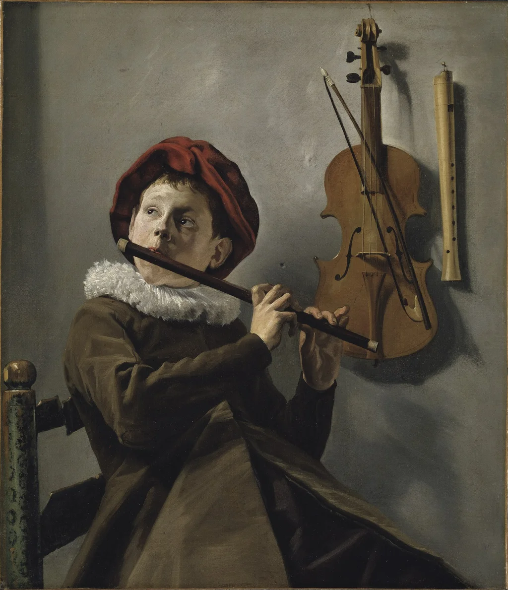 Muchacho tocando la flauta