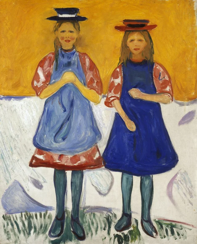 Due ragazze con grembiuli blu
