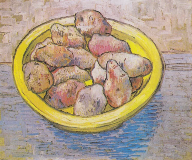Stillleben: Kartoffeln auf einer gelben Schüssel
