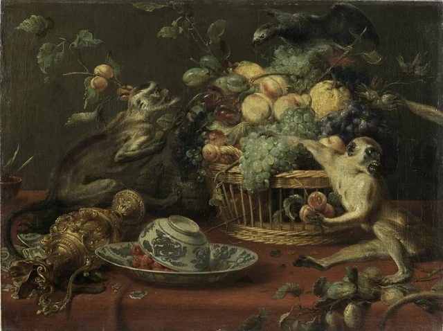 Monkeys and parrot near a fruit basket