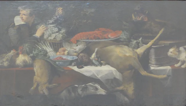 Kitchen scene with game and vegetables, with a serving boy holding a bunch of grapes