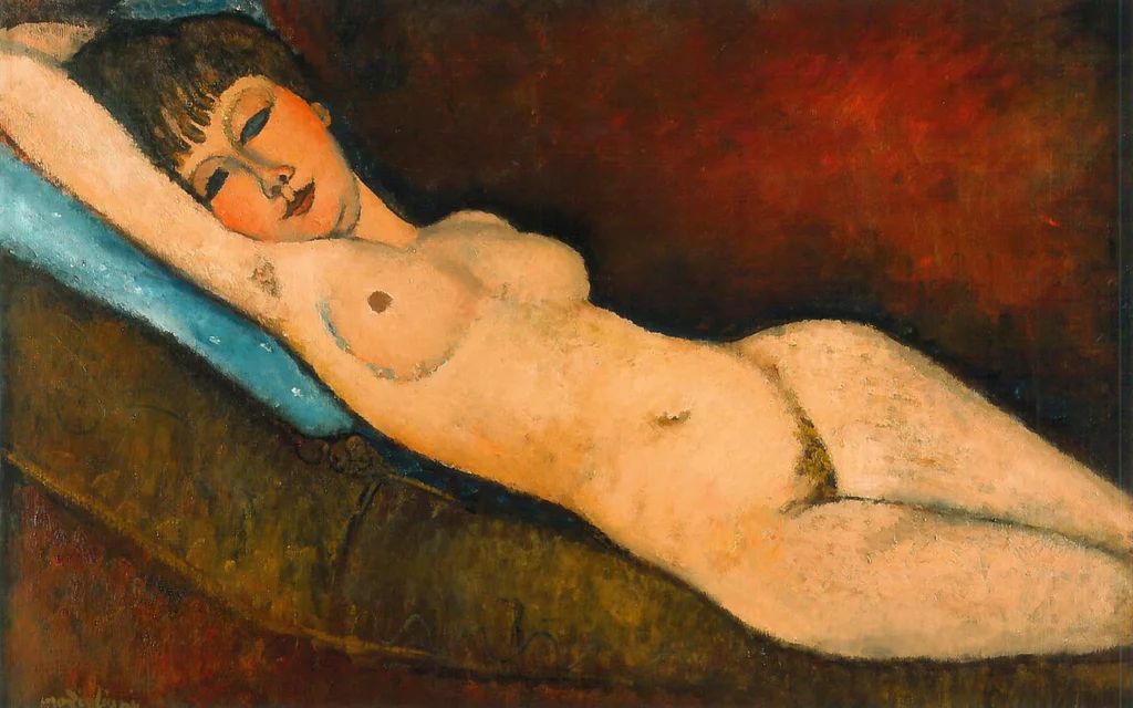 Desnudo reclinado sobre cojín azul