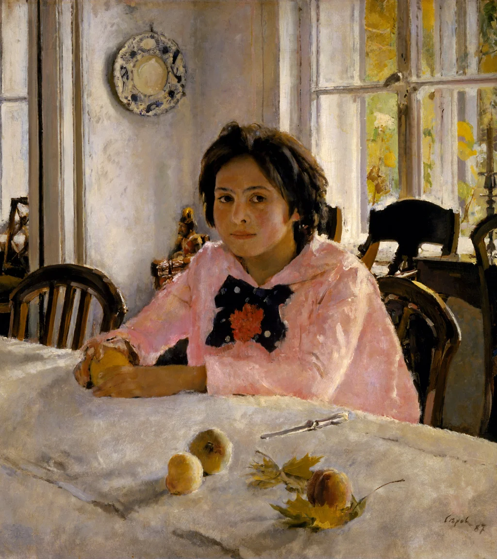 Niña con melocotones