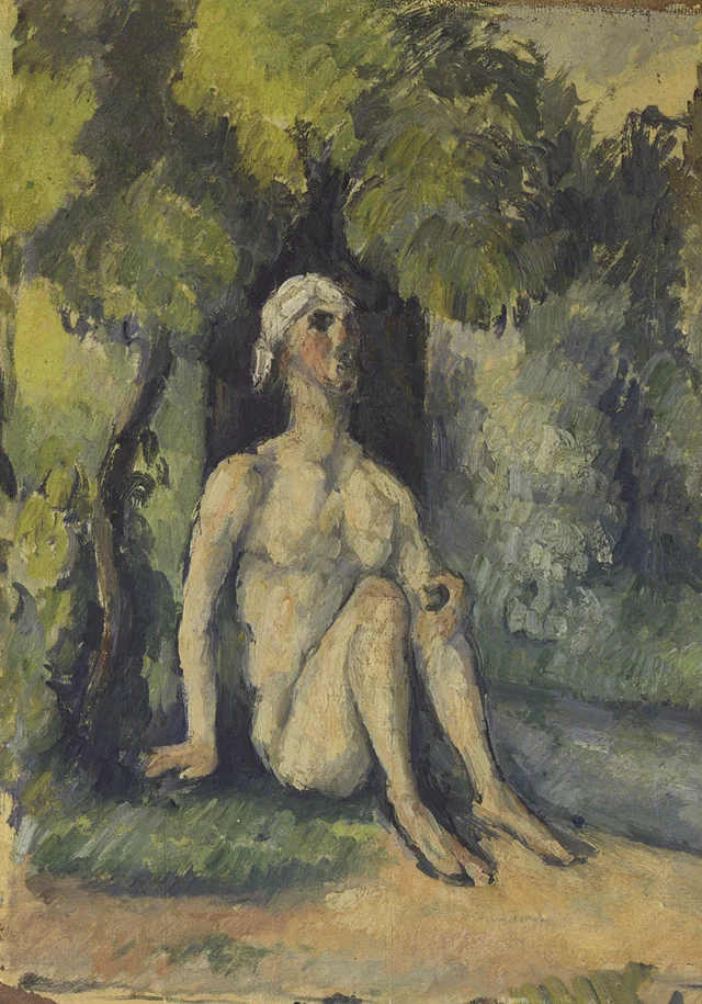 Baigneur assis au bord de l'eau